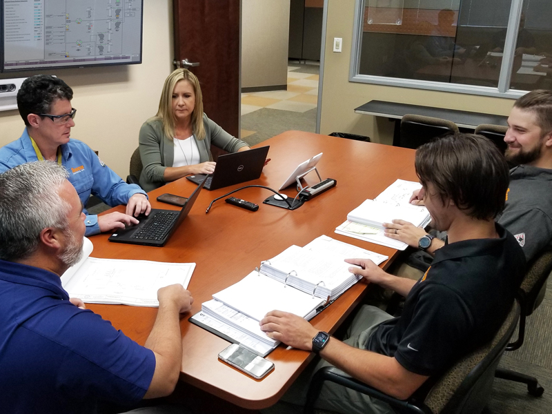 EMASS team, a SCADA engineer and project manager are assessing a client's system before going onsite.