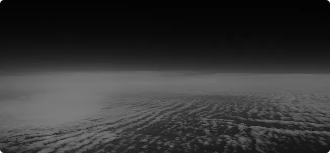 View of cloud formations from above against a dark sky gradient.