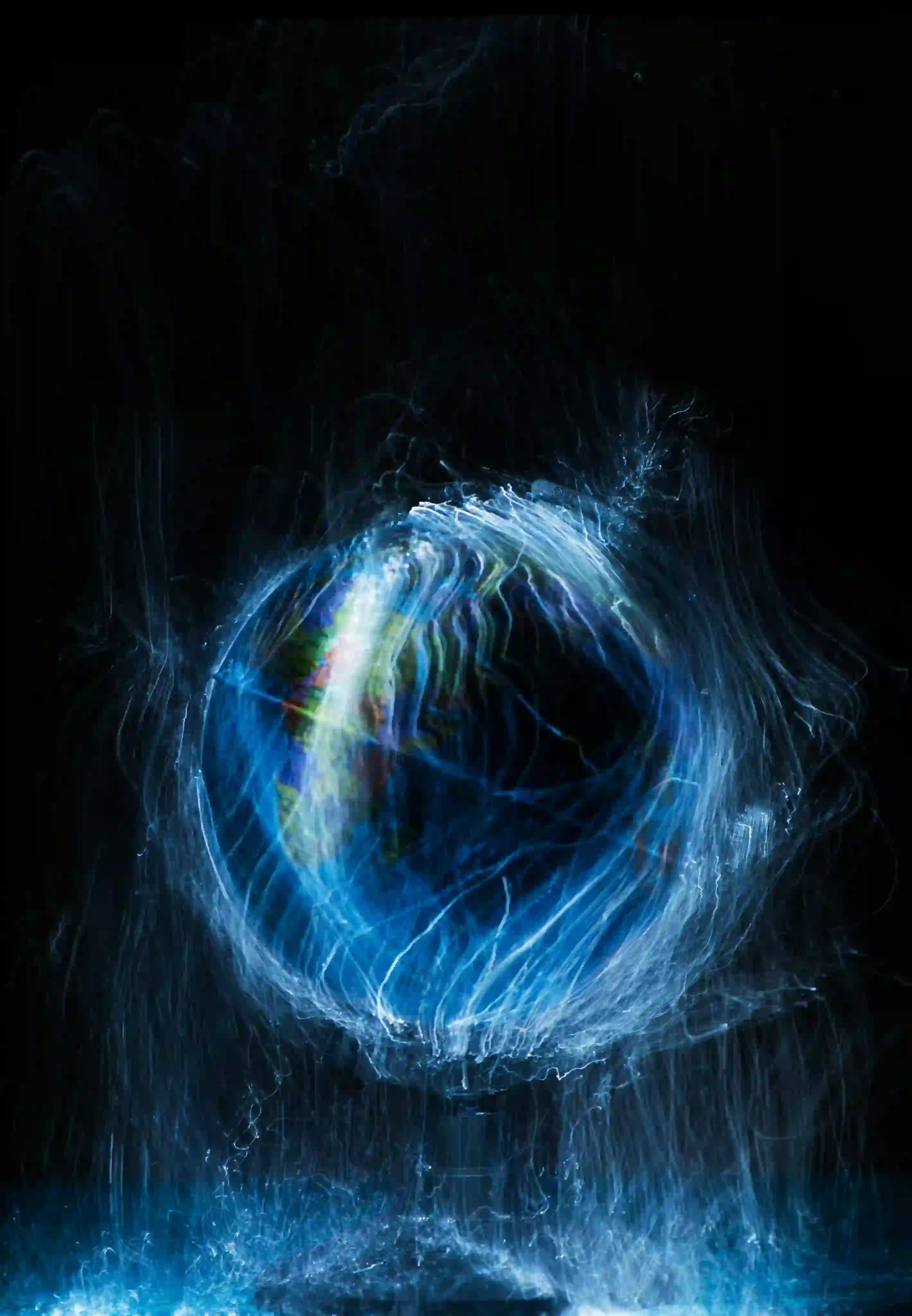 Globe illuminated with blue light streaks creating a dynamic, swirling effect against a black background.