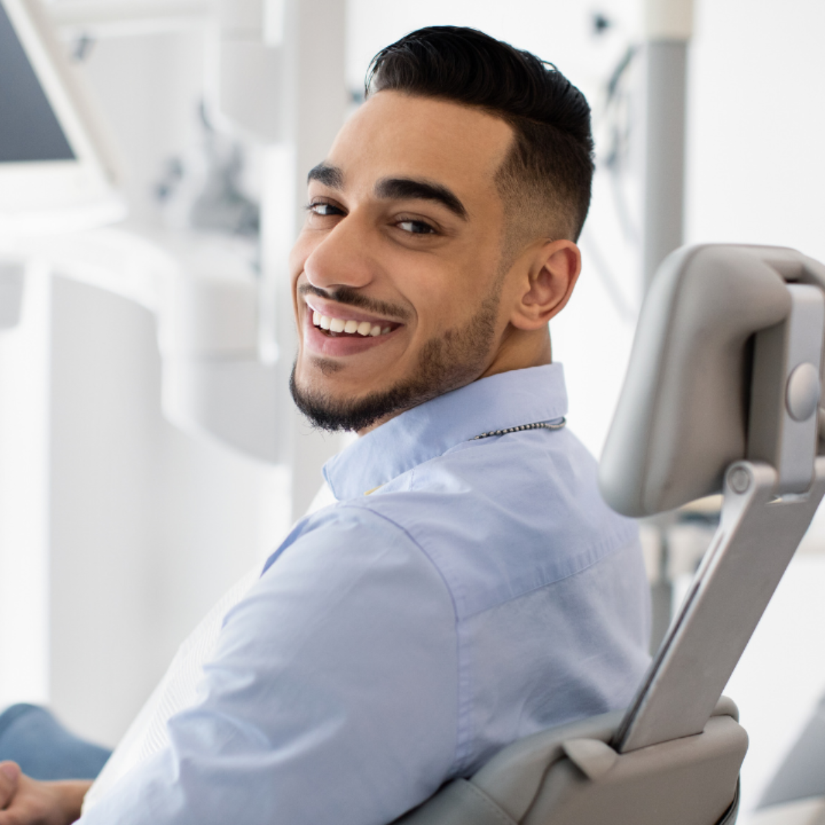 Physiologic dental patient smiling at camera