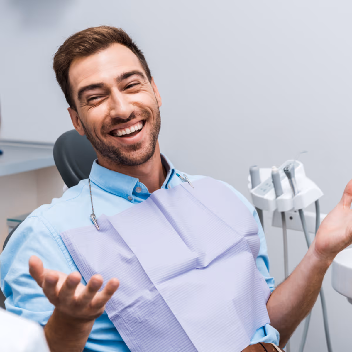 Root canal dental patient smiling and shrugging
