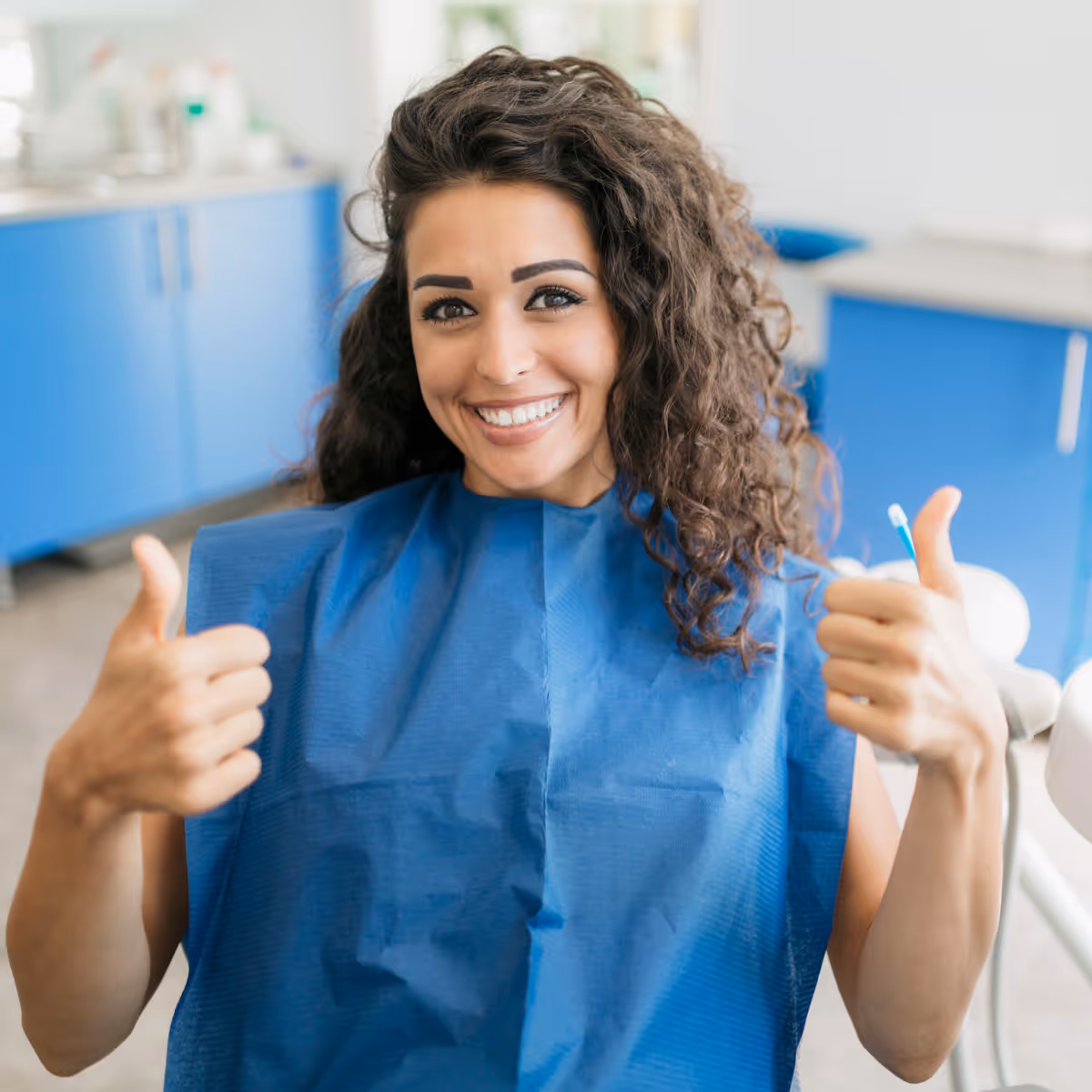 Emergency dental patient giving thumbs up