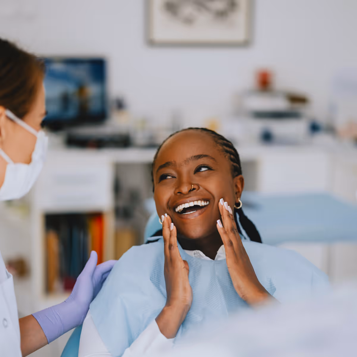 Dental patient smiles at dentist