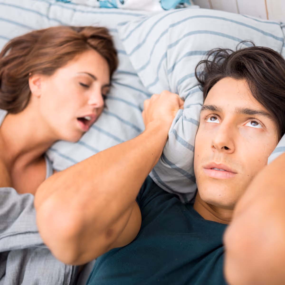 Man cannot sleep while partner snores