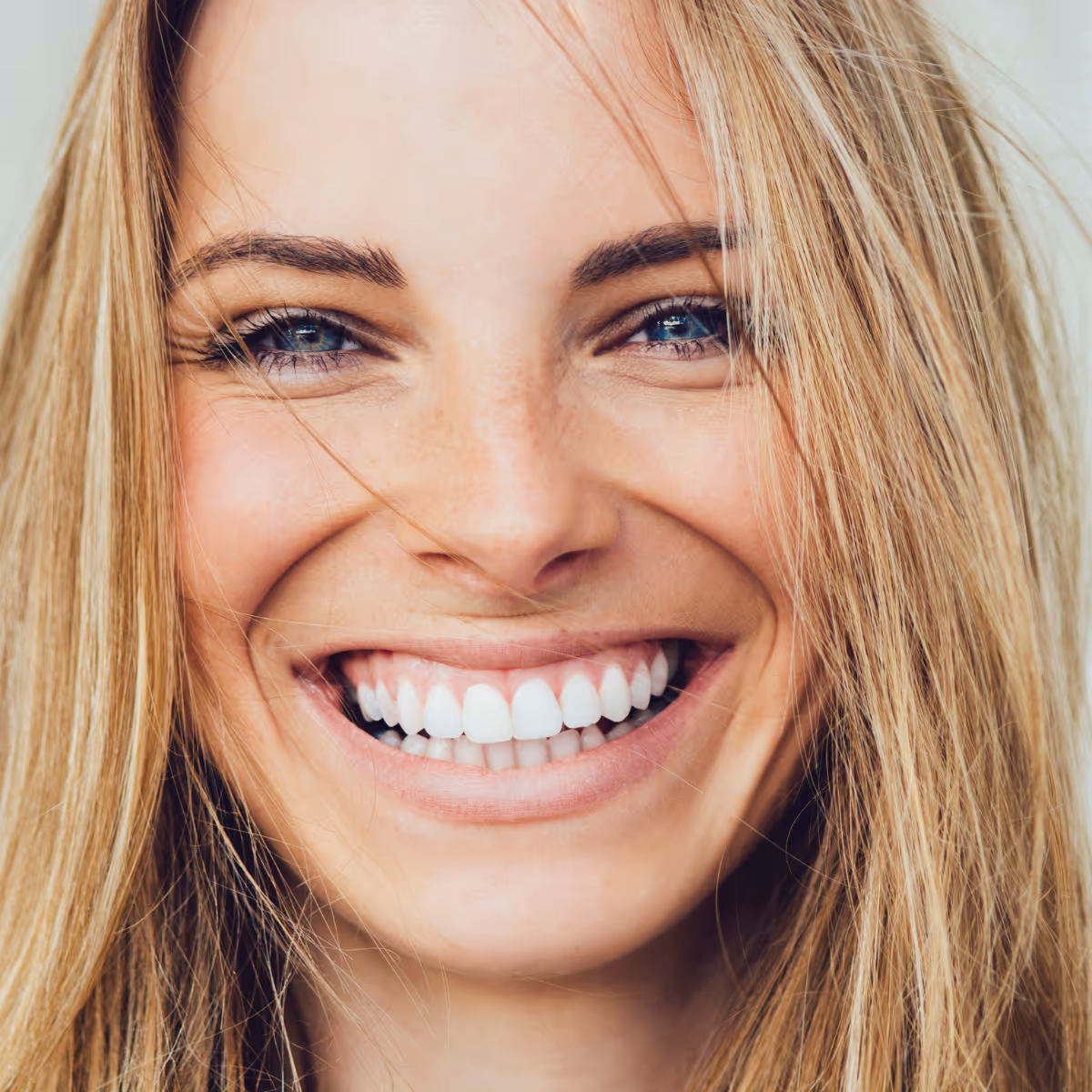 Woman smiling after root canal service