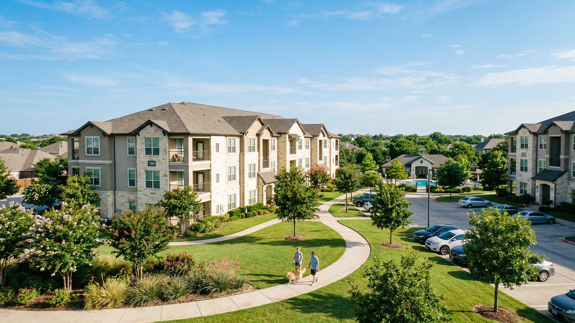 Window cleaning professional servicing a multi-unit residential property with pure water cleaning equipment