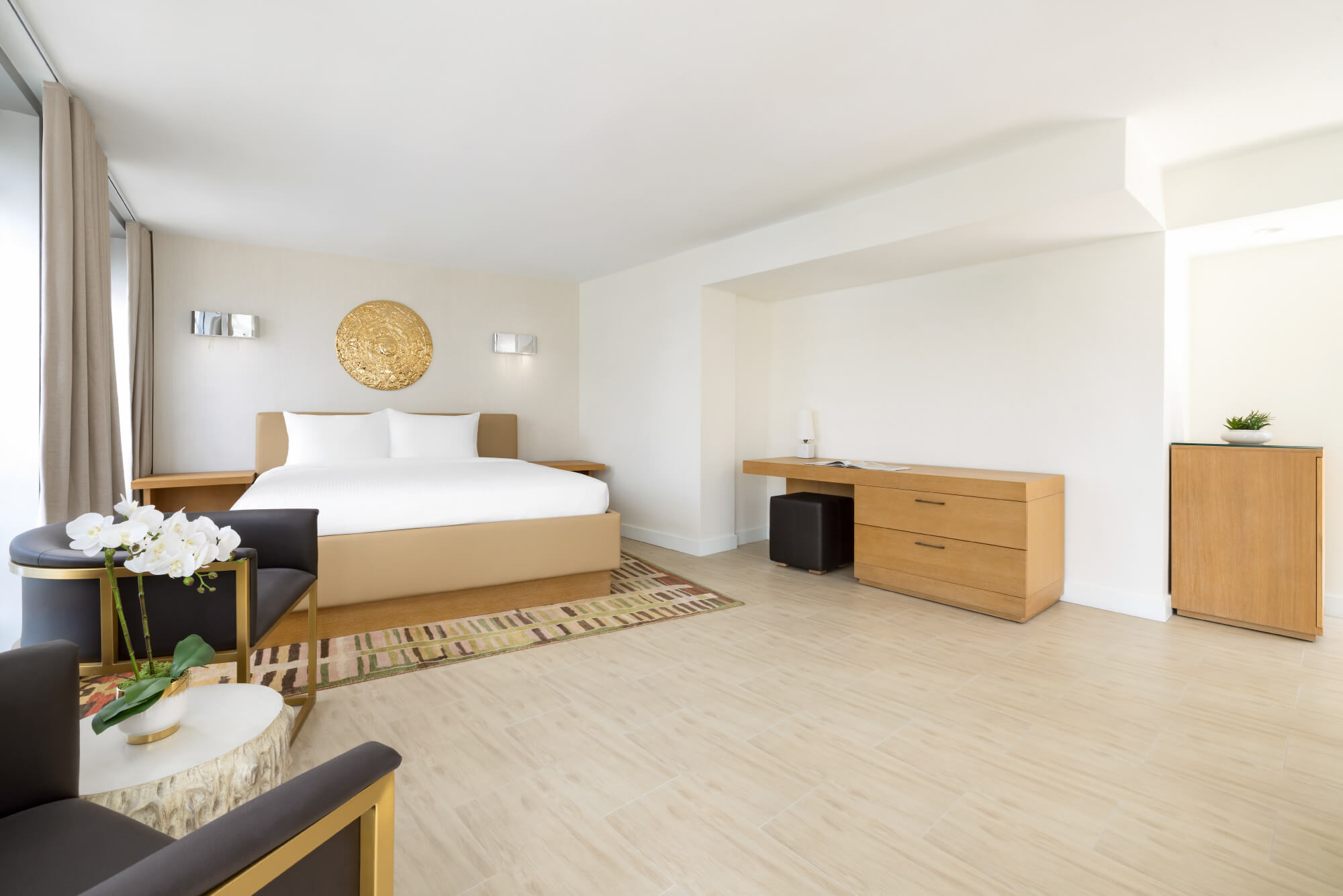 Elevate your Miami vacation in our expansive 550-square-foot suite, boasting a dedicated sitting area and a balcony. Comfortably accommodates up to four guests.