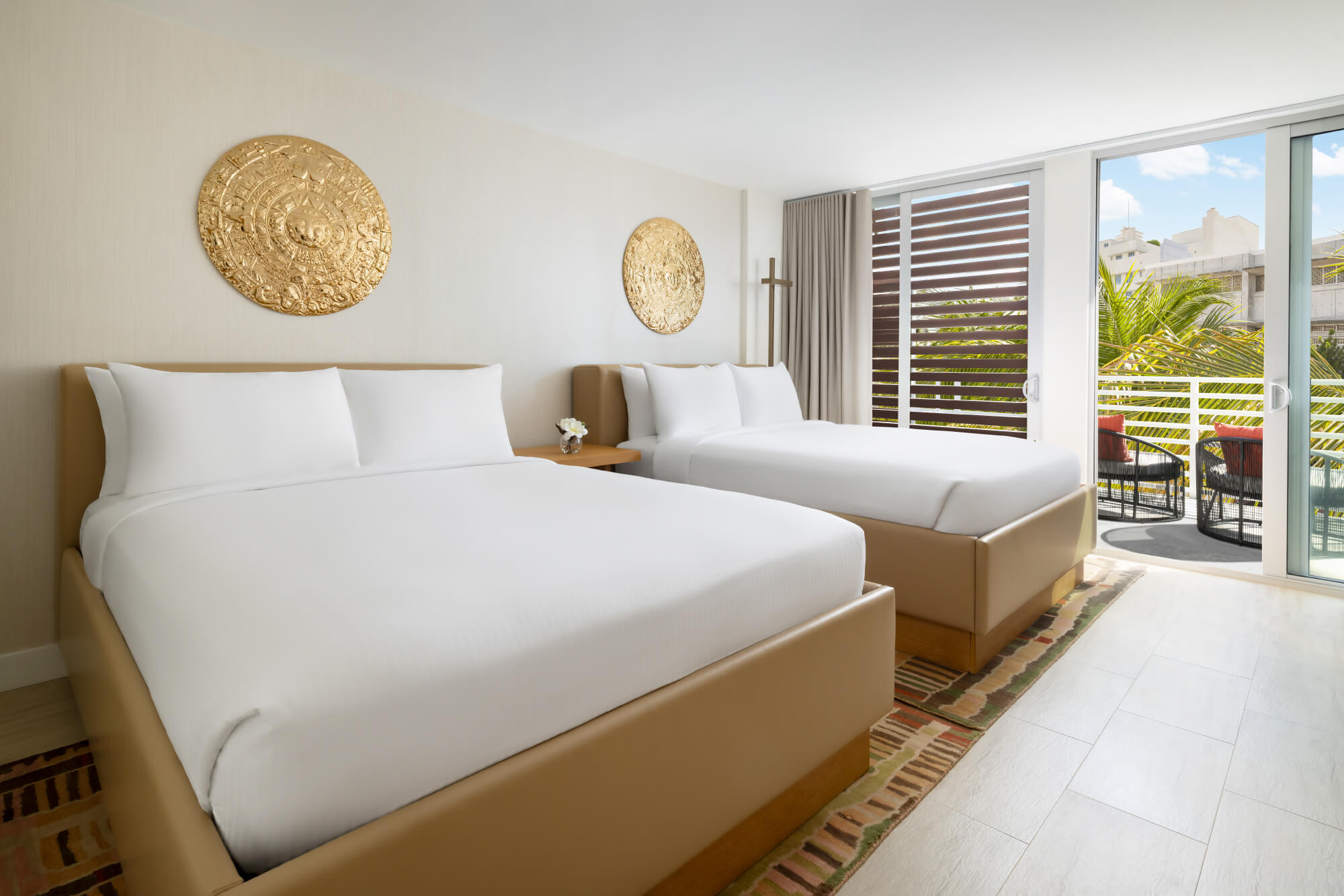 Wake up to partial ocean views straight from your own Juliette balcony. This cool, beachy room perfectly features two queen beds with modern perks.