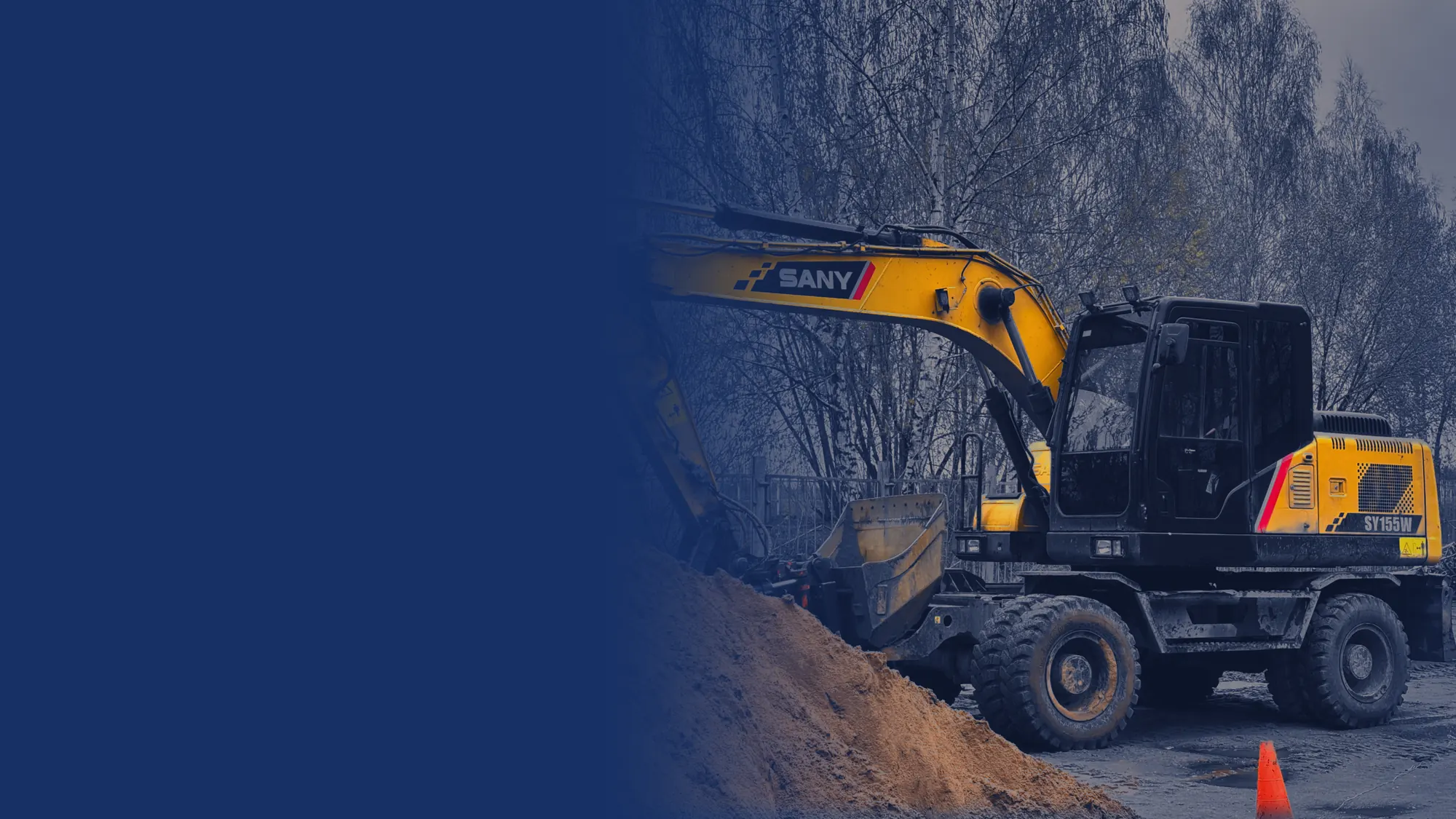 SANY wheeled excavator working beside a dirt pile