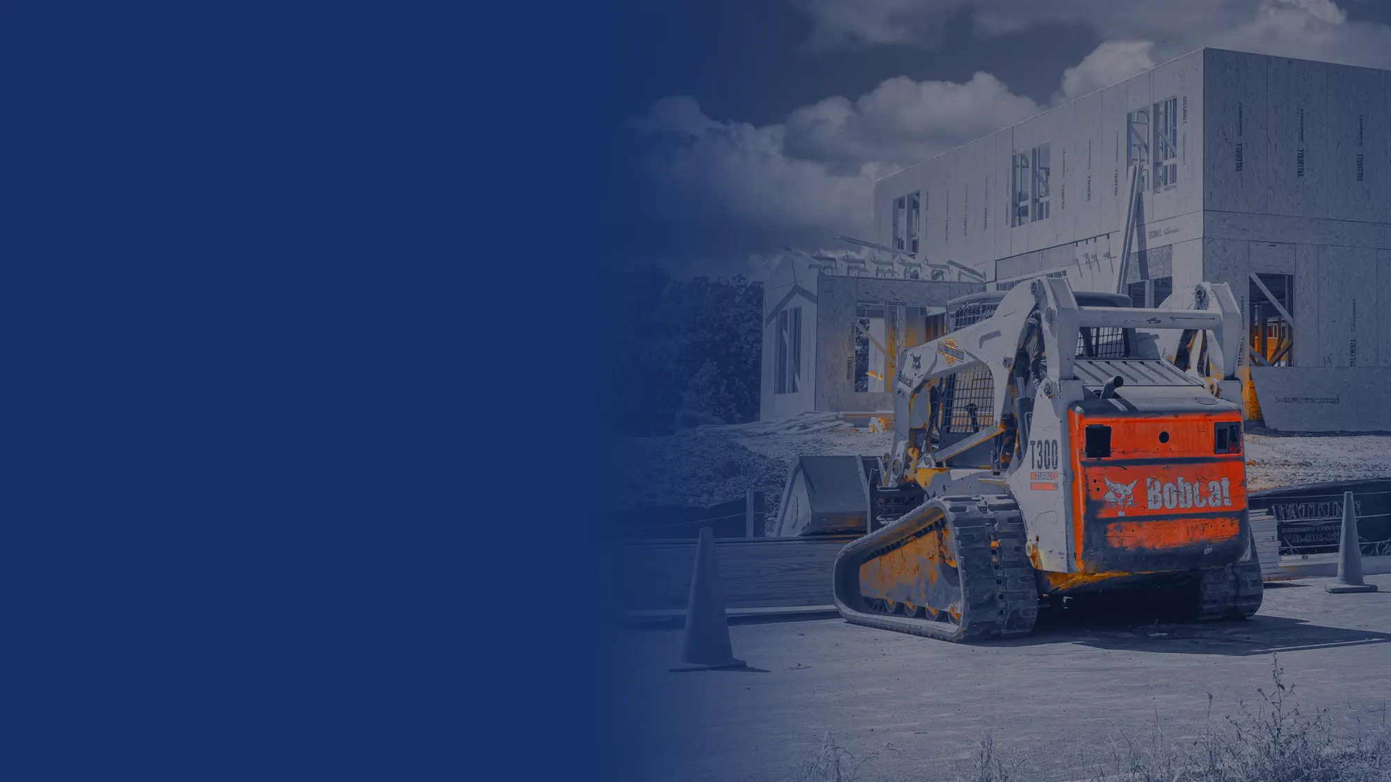 Bobcat compact track loader at a home construction site