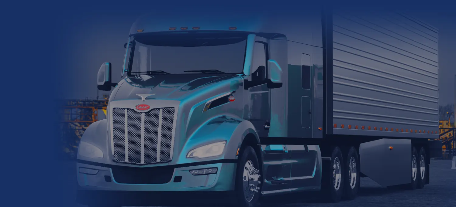 Peterbilt semi truck and trailer parked at an industrial yard