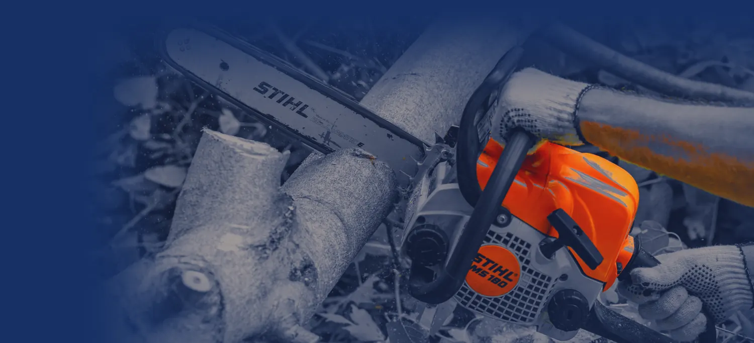 STIHL chainsaw cutting through a tree limb