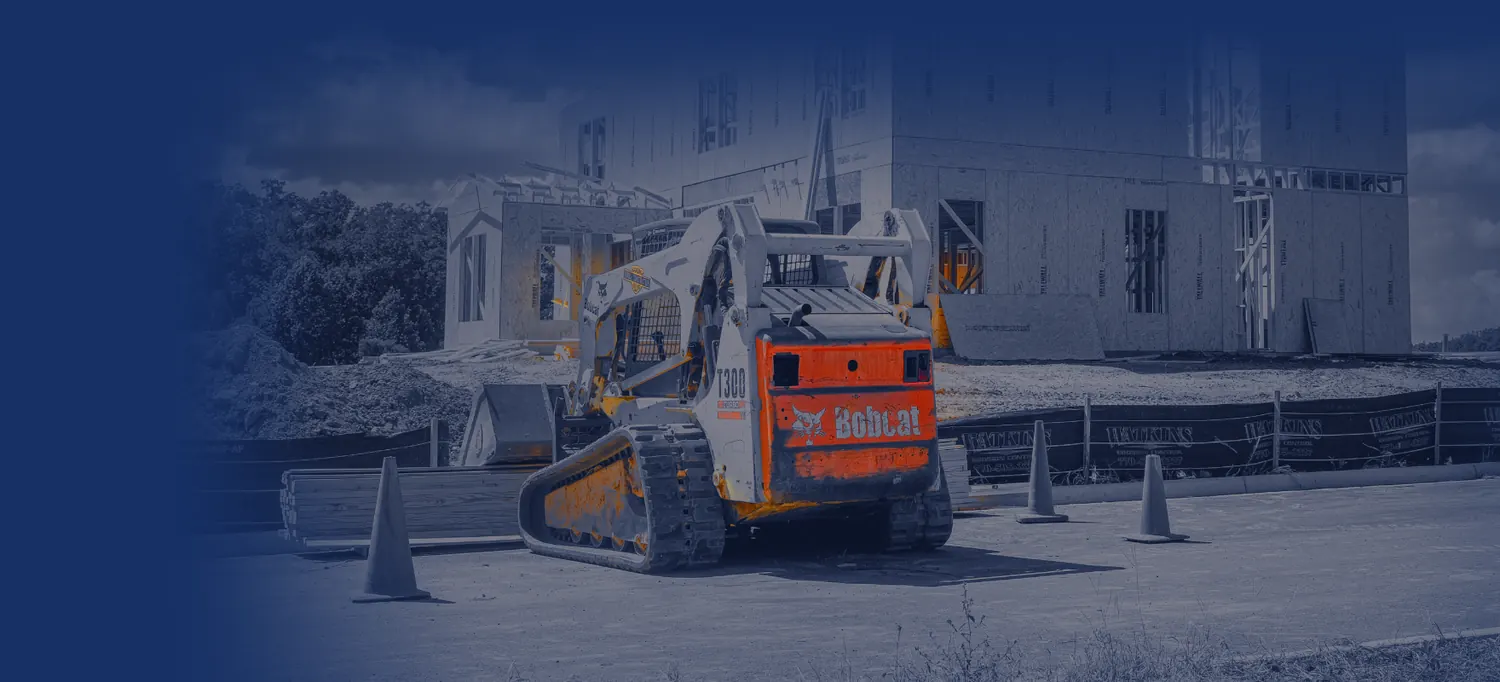 Bobcat compact track loader at a home construction site