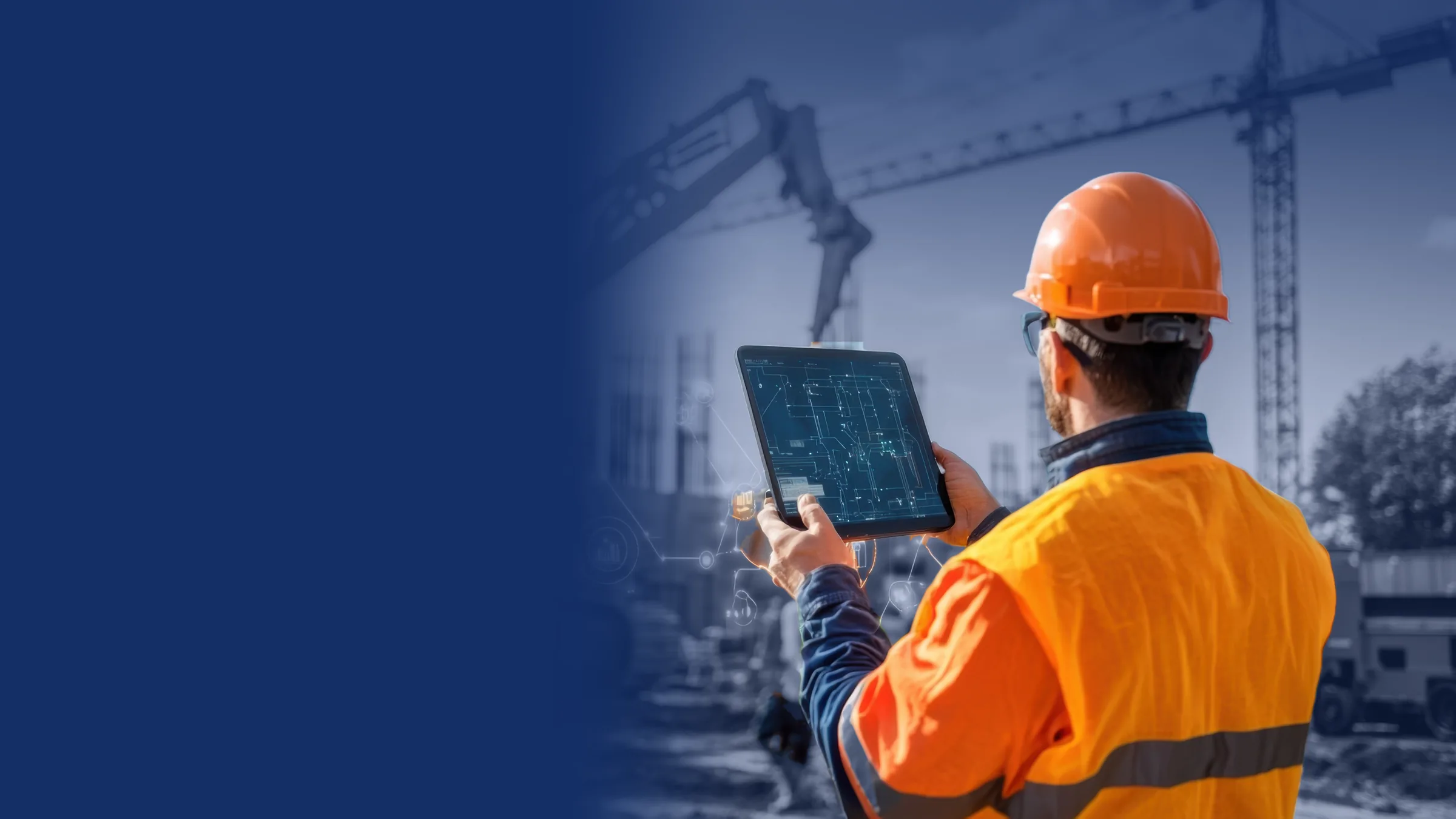 Site manager in a hard hat checking a tablet beside an excavator on a construction job site