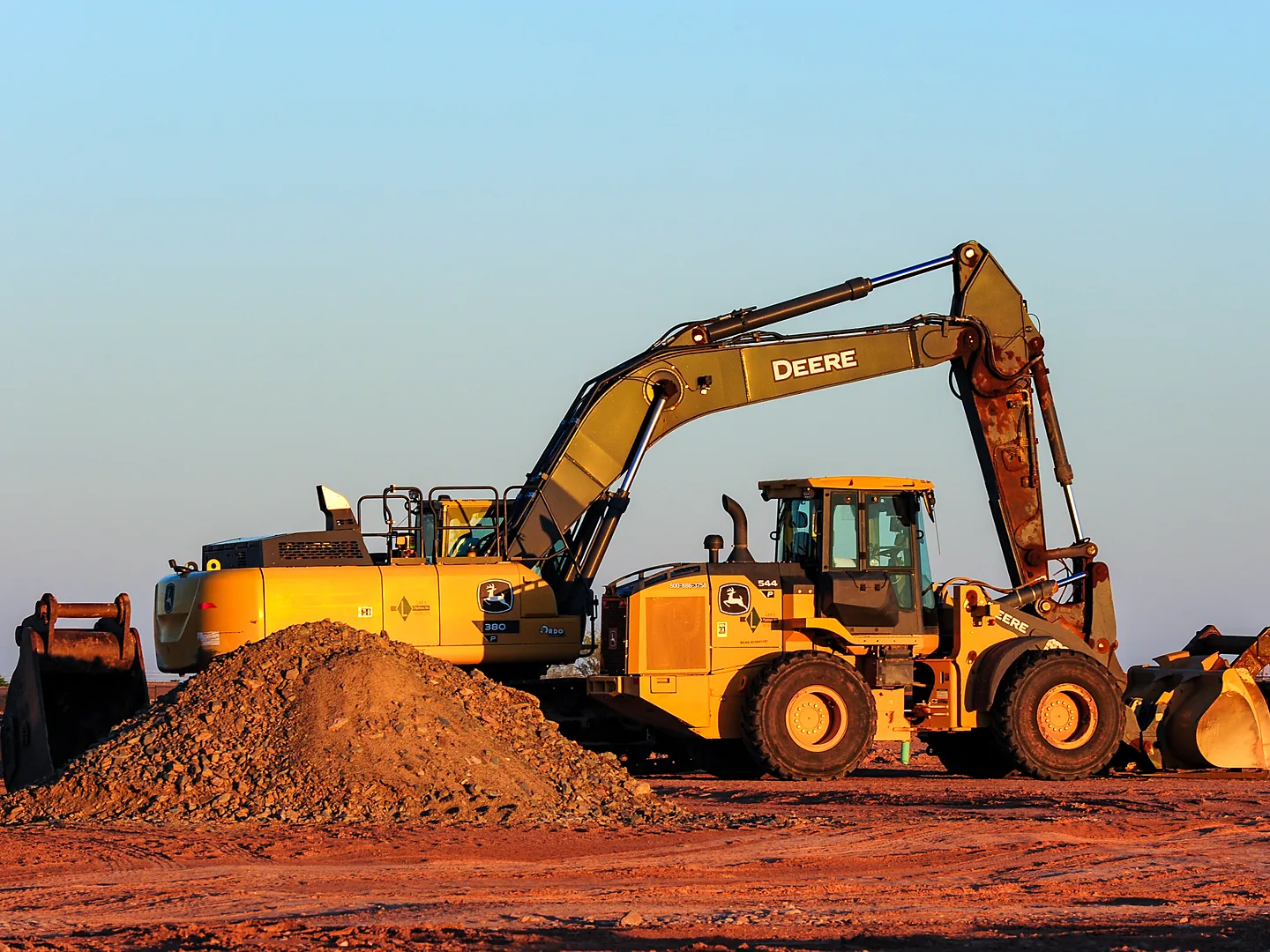 John Deere excavator and wheel loader on a job site