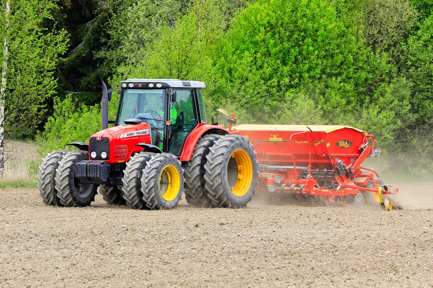 Massey Ferguson tractor pulling a seed drill