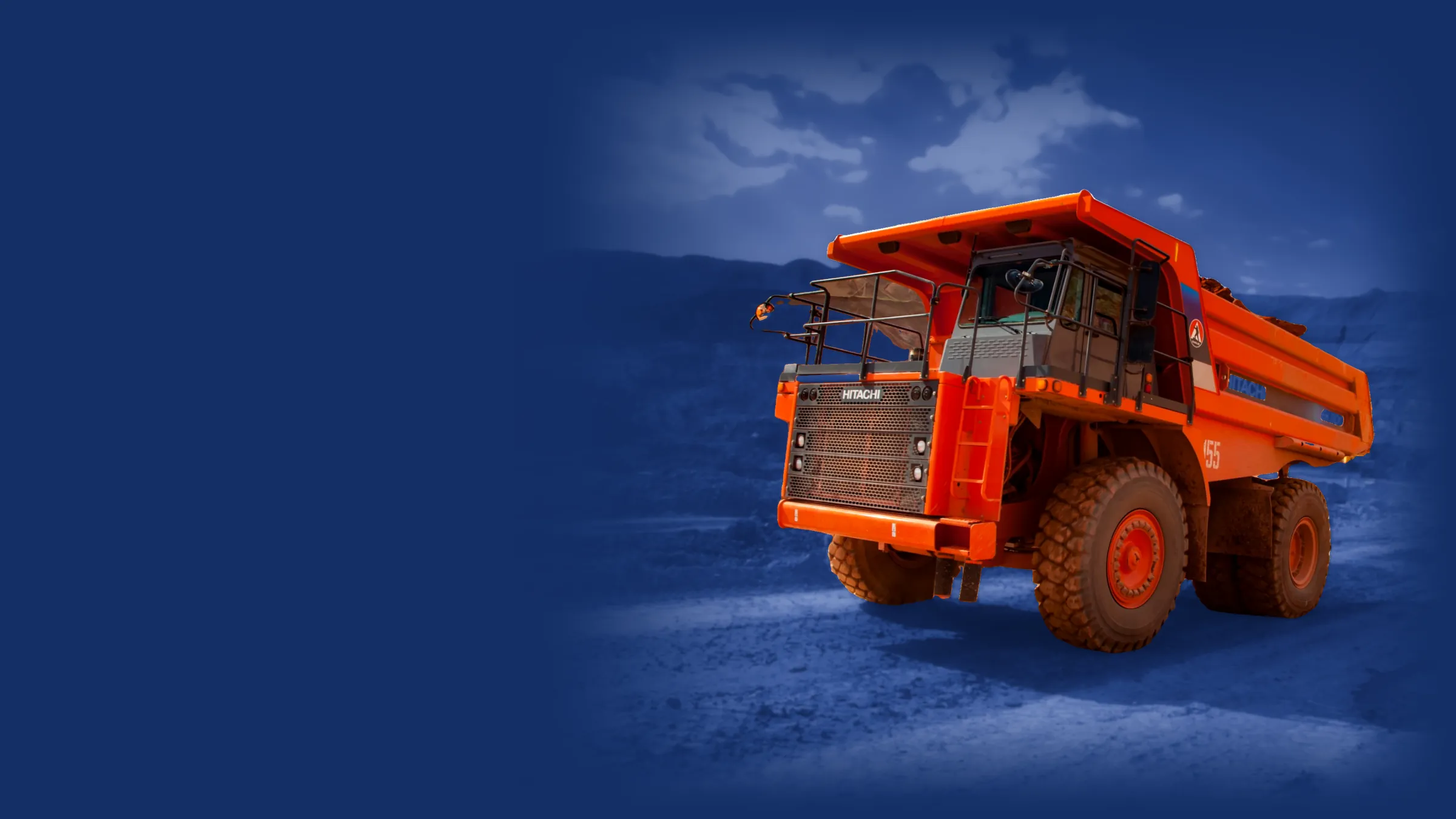 Hitachi EH1100 haul truck on a mine haul road