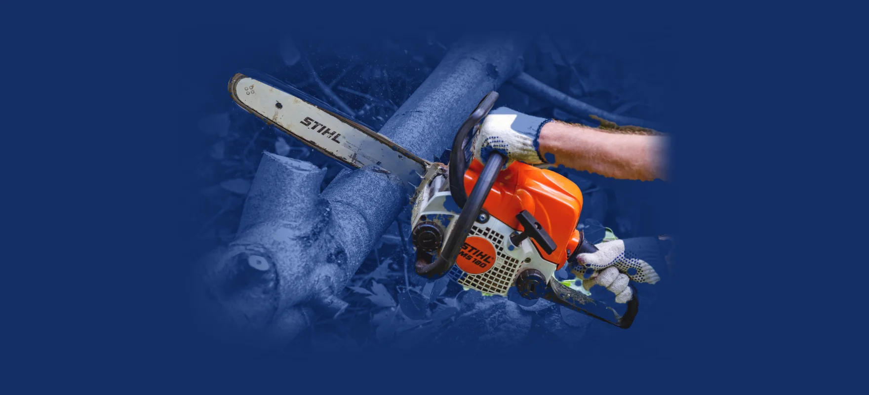 STIHL MS 180 chainsaw cutting through a tree branch