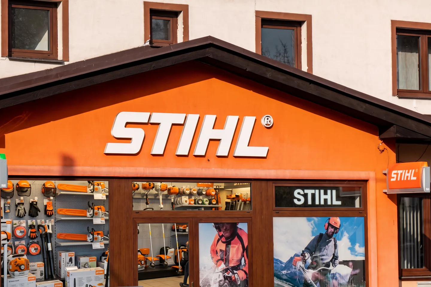 STIHL dealer storefront with helmets, chainsaws, and trimmers in the windows