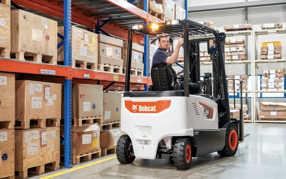Bobcat electric forklift working in a parts warehouse