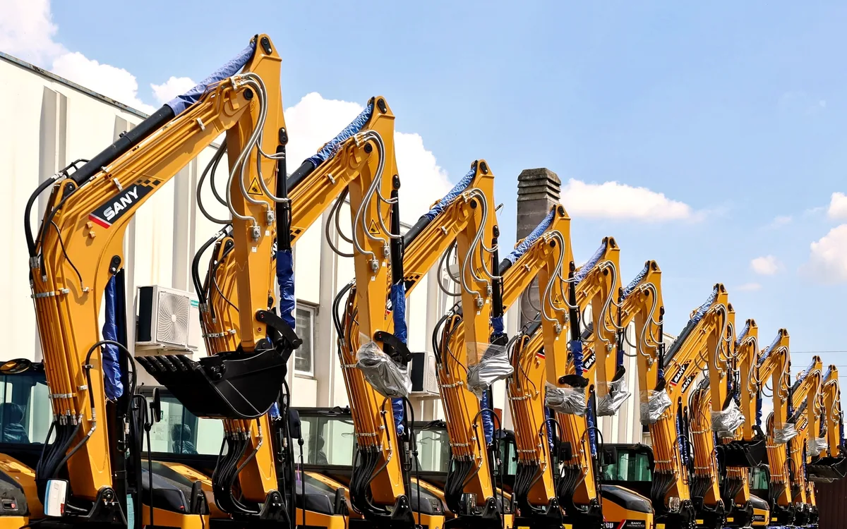 Row of new SANY excavators on a dealer lot