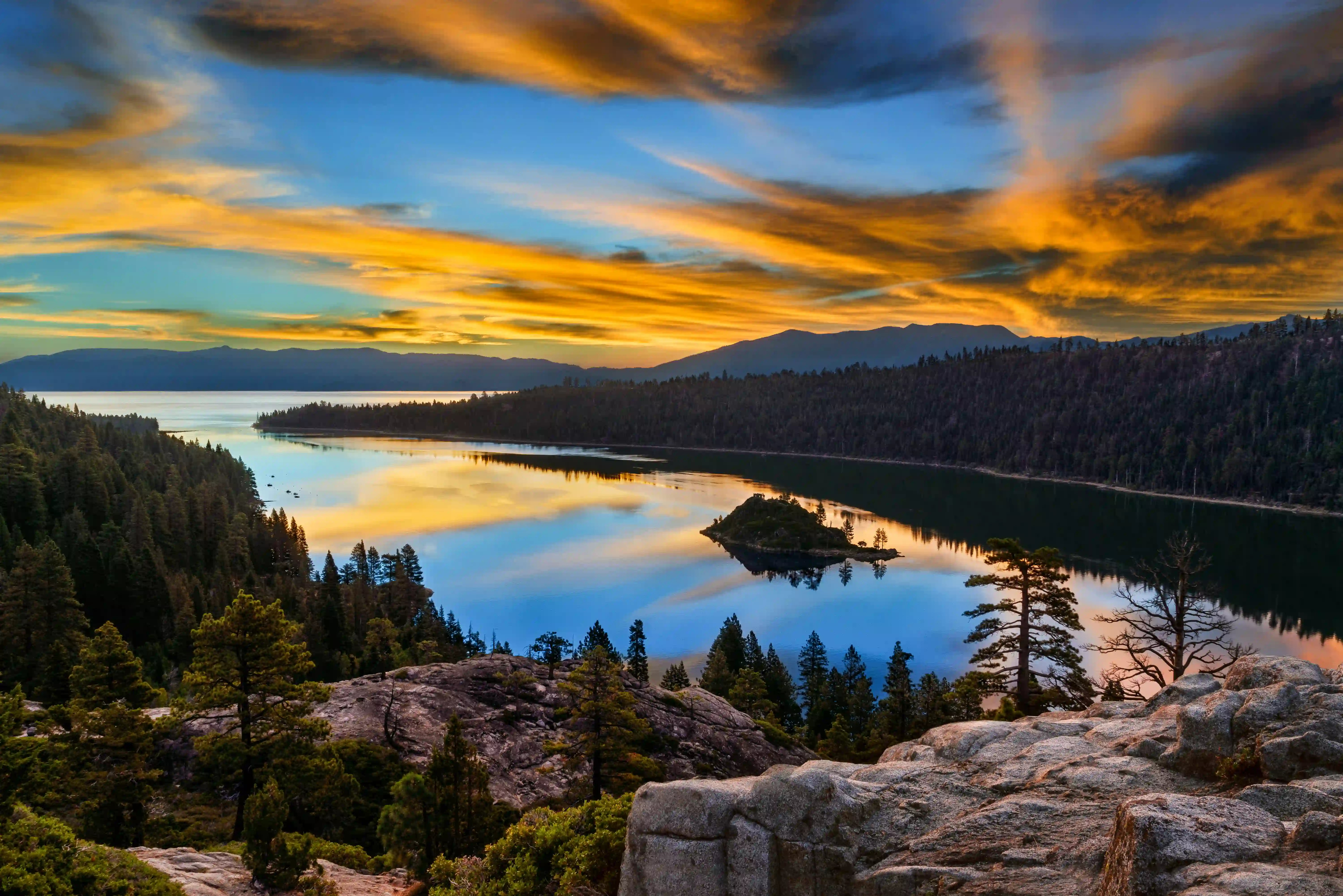 an aerial view of a lake during sunset in el dorado county