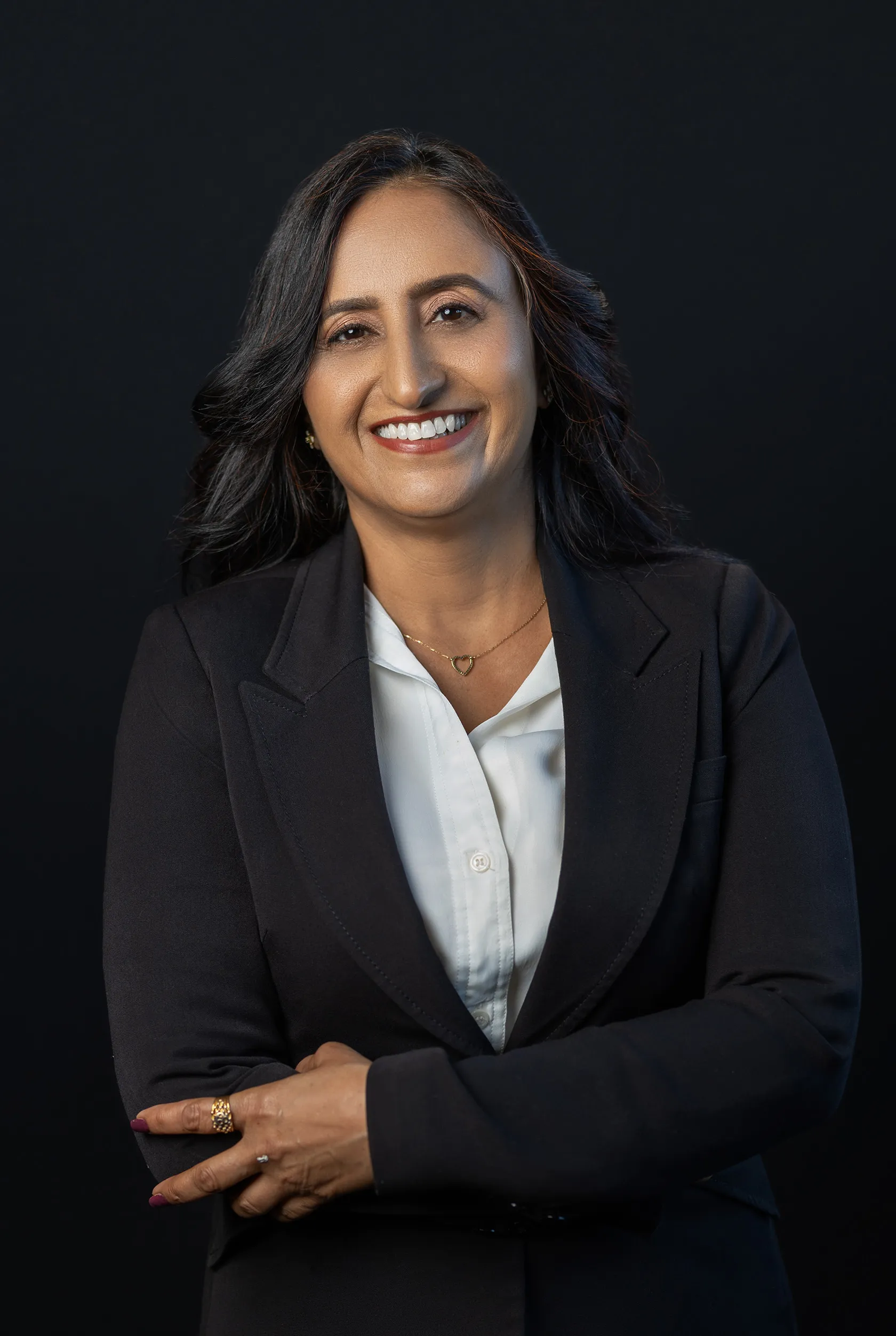 a professional headshot of Neena Khullar