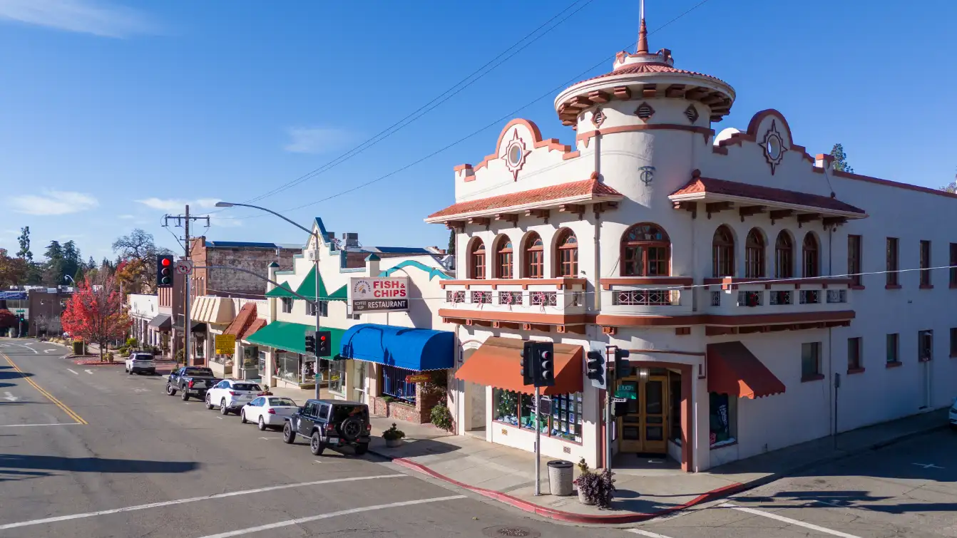Classic Spanish-style architecture in Auburn CA's downtown with clear blue skies.