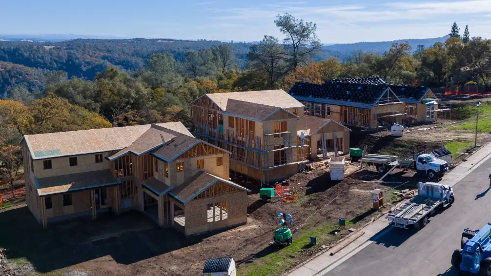 New residential housing construction with partially completed homes in Auburn, CA.