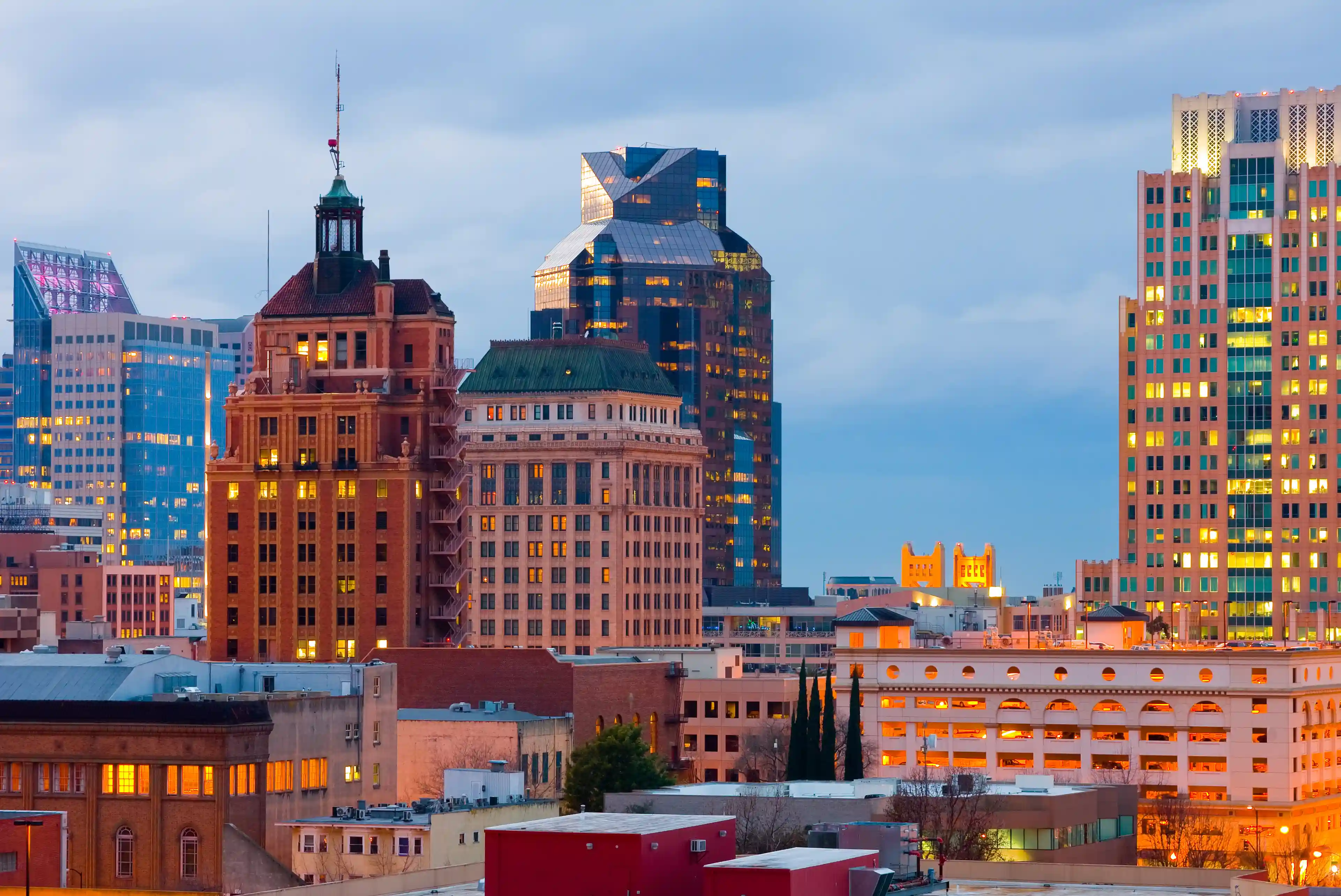 a view of a Sacramento city at night with buildings lit up