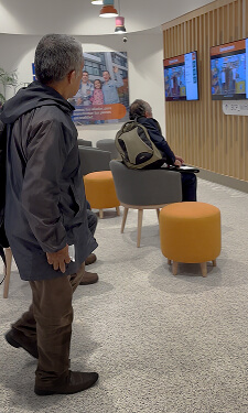 User waiting and tracking queue status on display screens as part of the turn management system experience