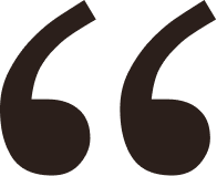 Black stylized quotation mark symbol on a white background.