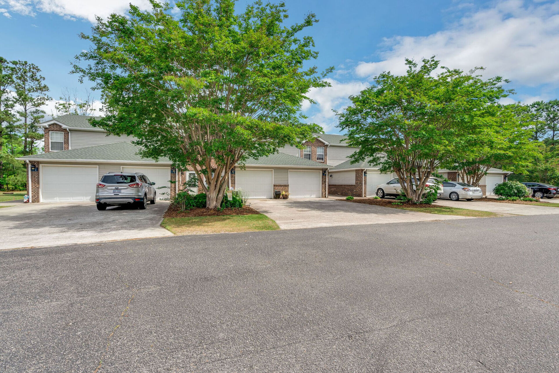 Wild Geese Landing exterior with cars and garages