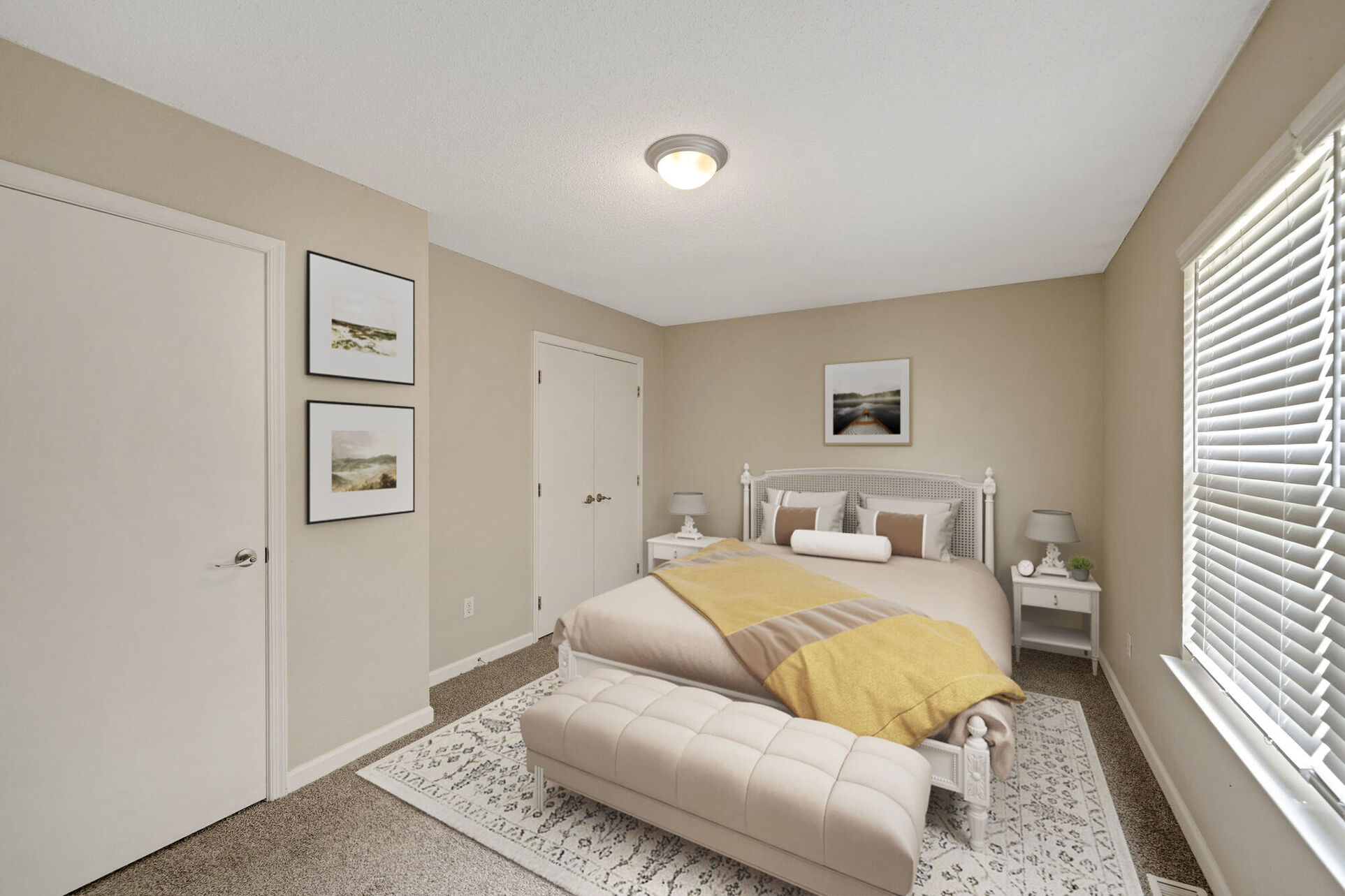 Bedroom with bed, bedside table with lamp and wall decor