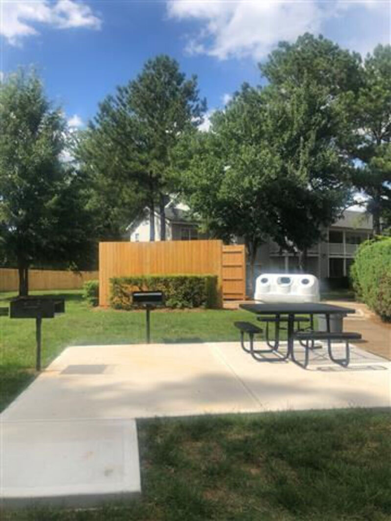 Outdoor area with bench and barbecue