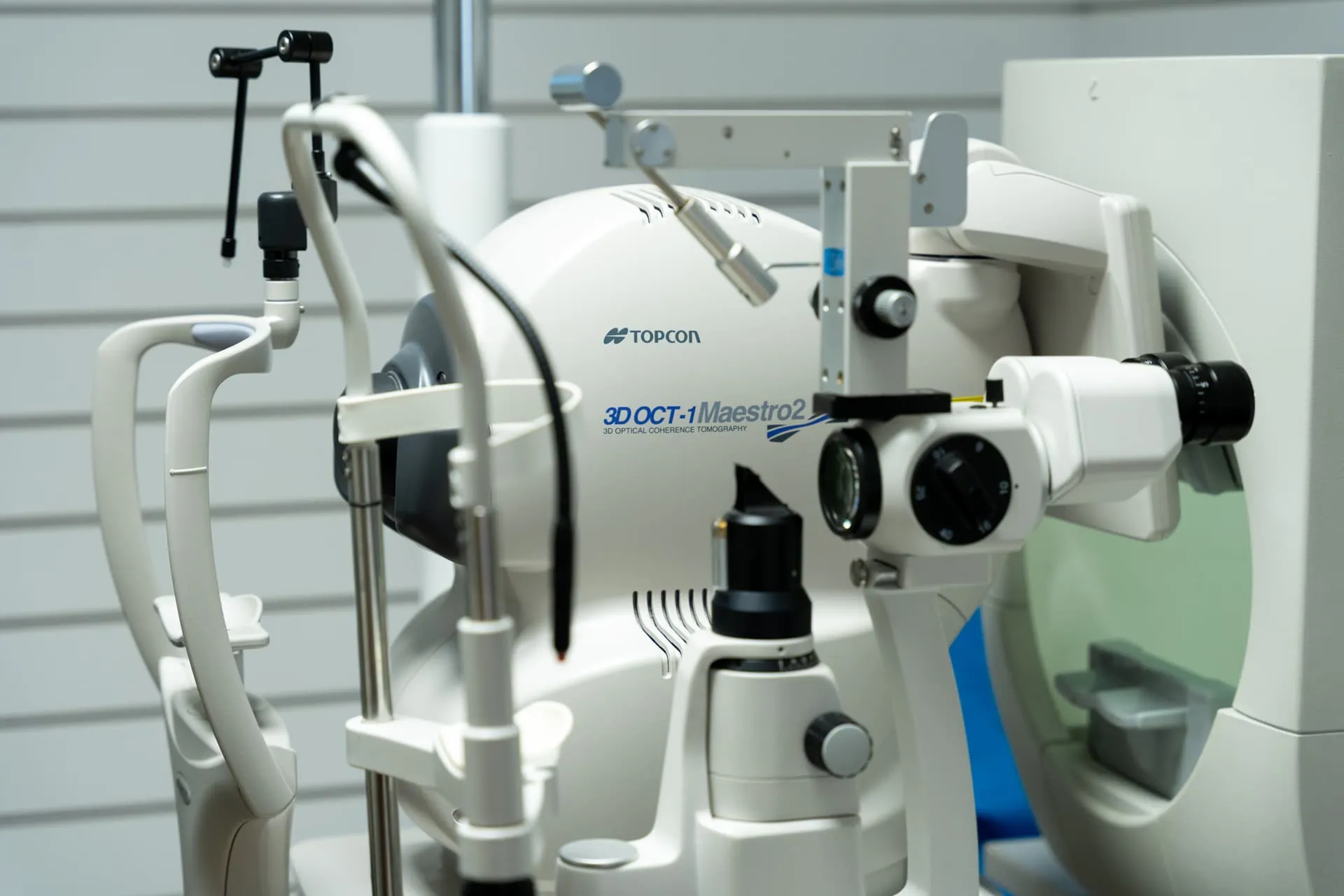 Close-up of a Topcon 3D OCT-1 Maestro2 optical coherence tomography machine used for detailed eye exams.