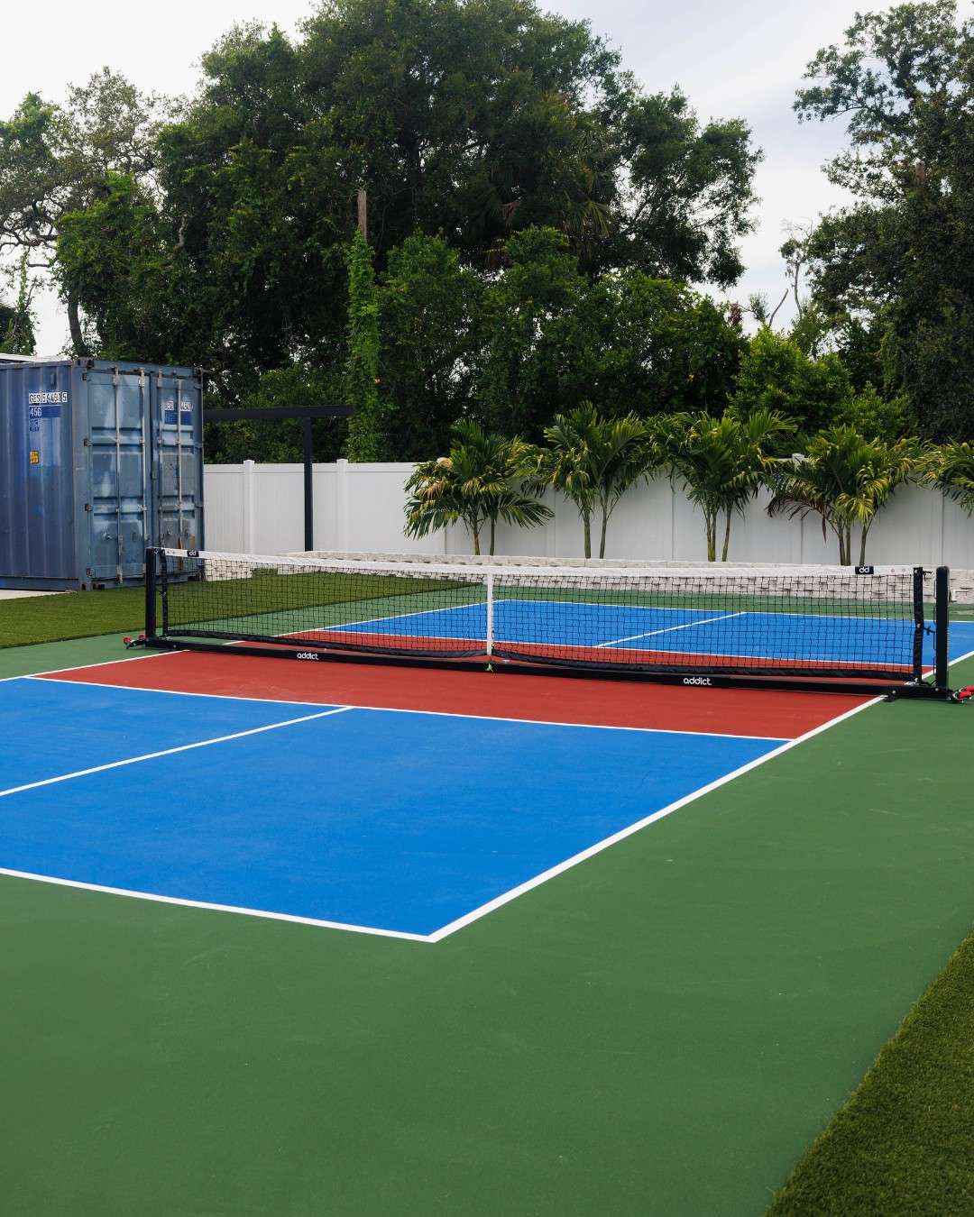 Three-color acrylic pickleball court surface at Ybor City residential property