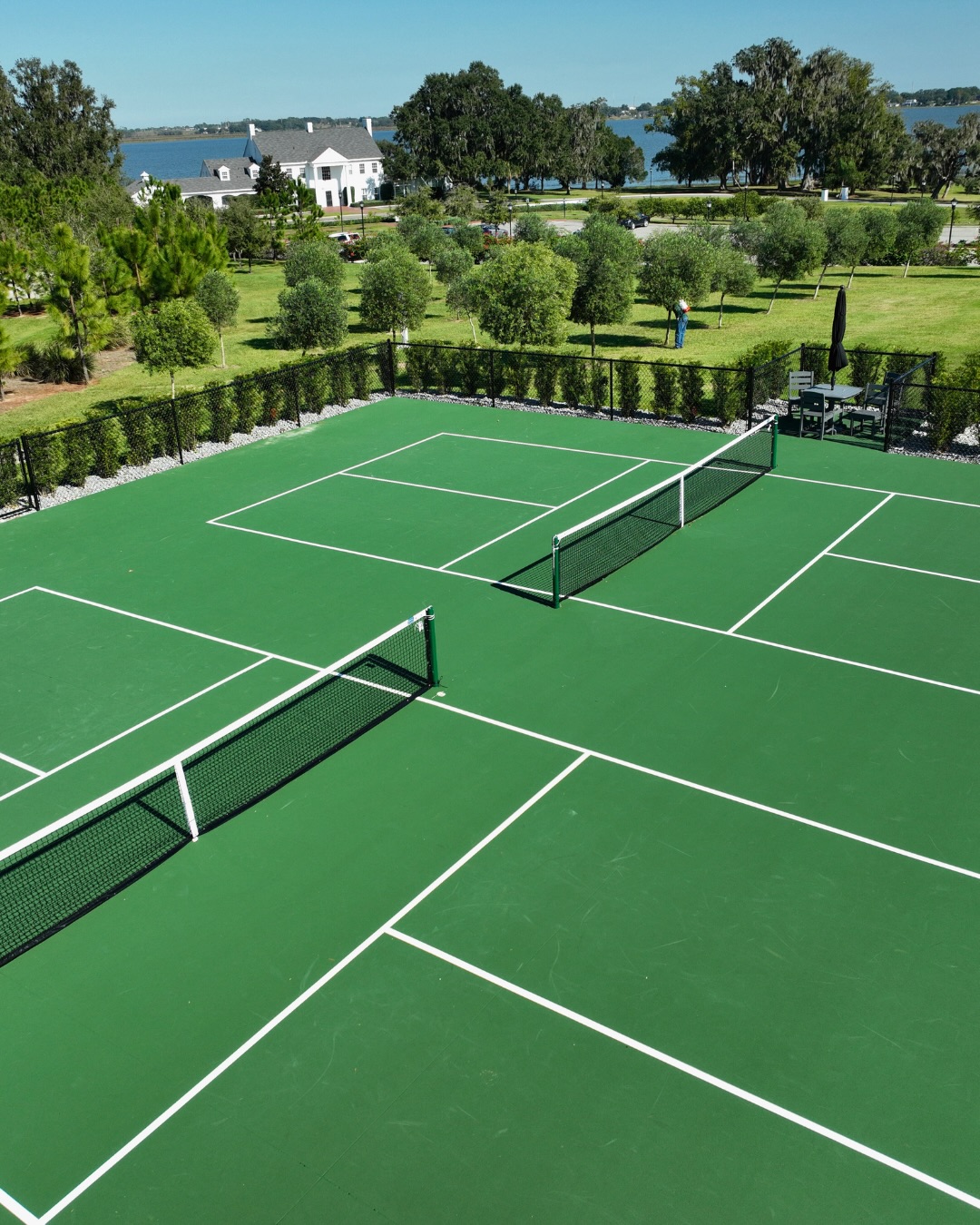 Net system installation at Adams Estate two-court pickleball facility