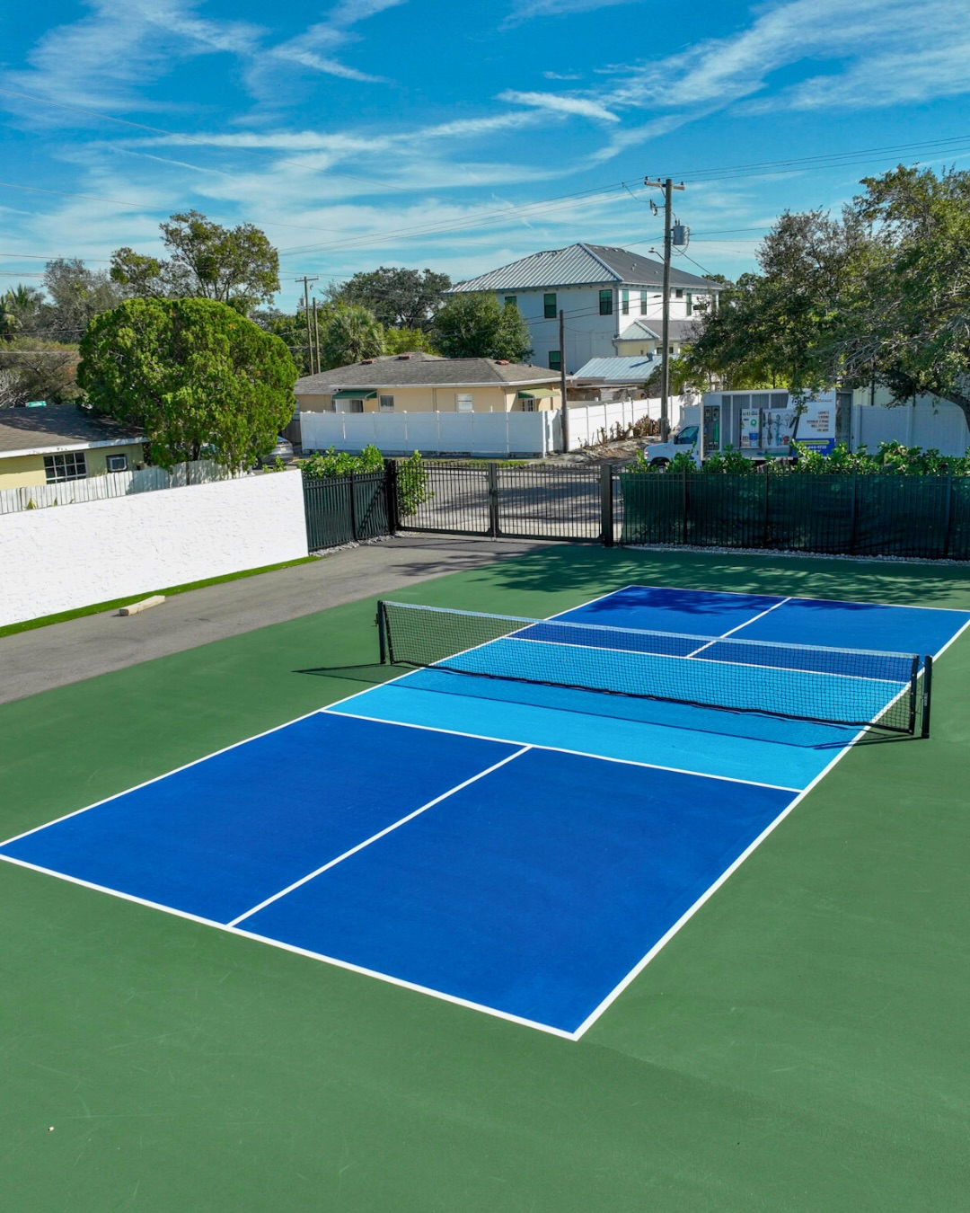 Half basketball court with Megaslam hoop at Patel private multi-sport facility