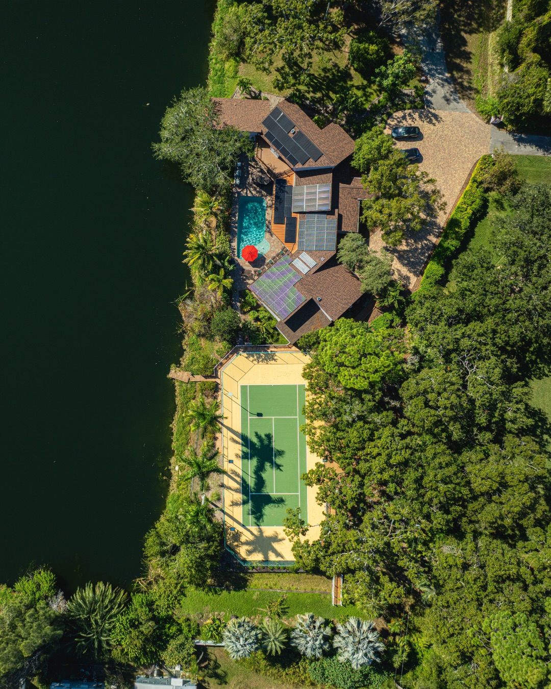 Completed tennis court restoration at lakeside Goldsmith Residence in Largo, FL