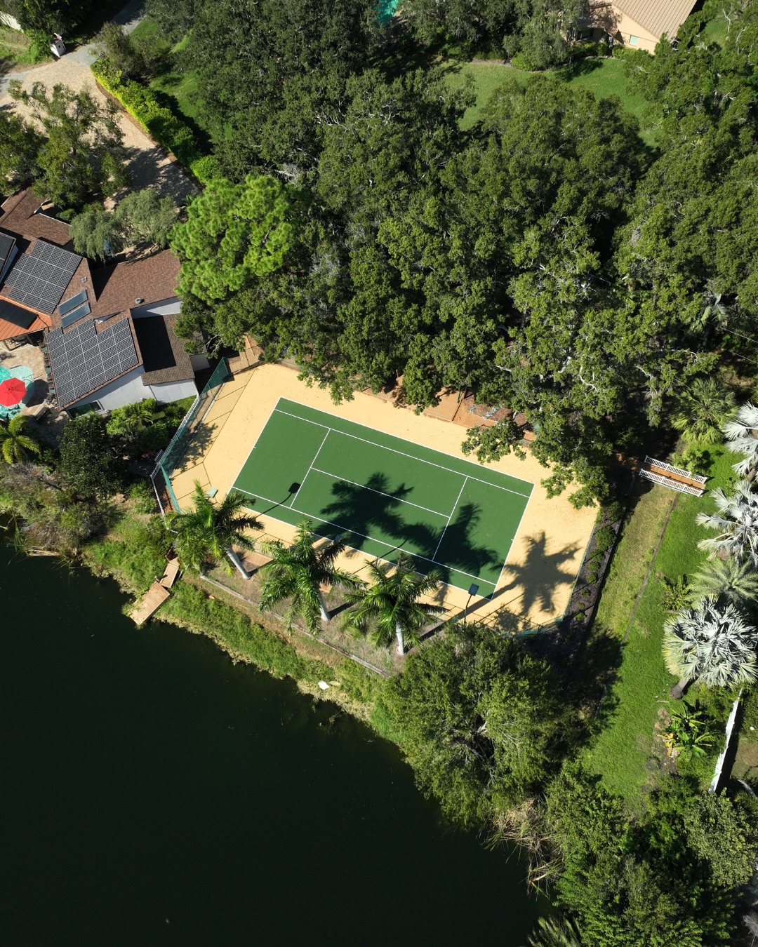 Acrytech two-color tennis court surface after restoration at Goldsmith Residence Largo
