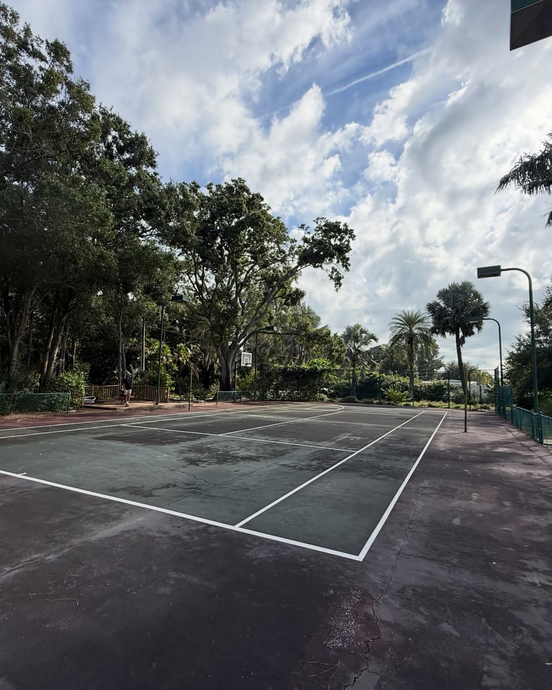 Fresh line striping on restored tennis court at Goldsmith Residence Largo