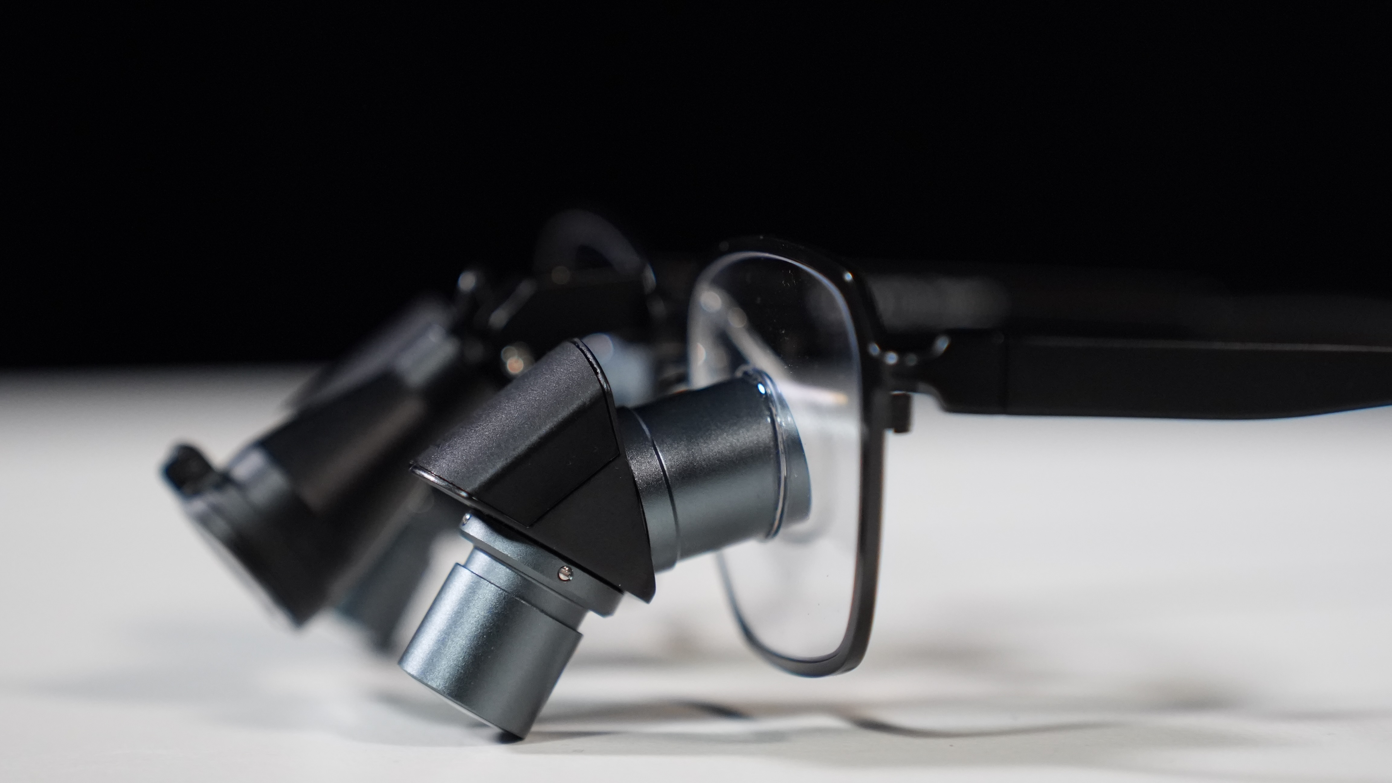 Close-up of black-framed prismara ergonomic loupes