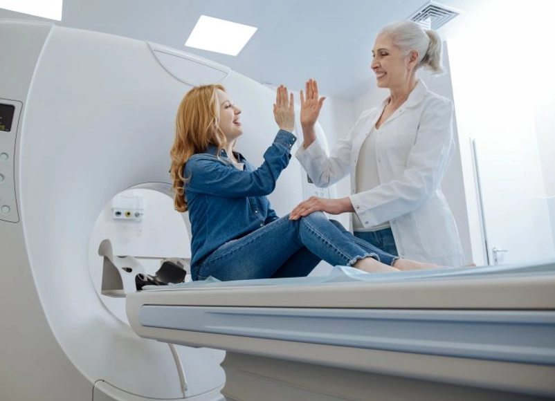 Doctor with patient in MRI machine
