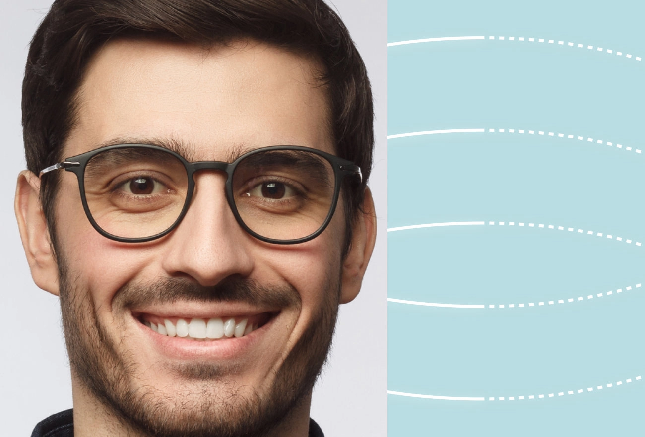 Smiling man with glasses beside facial measurement lines on light blue background