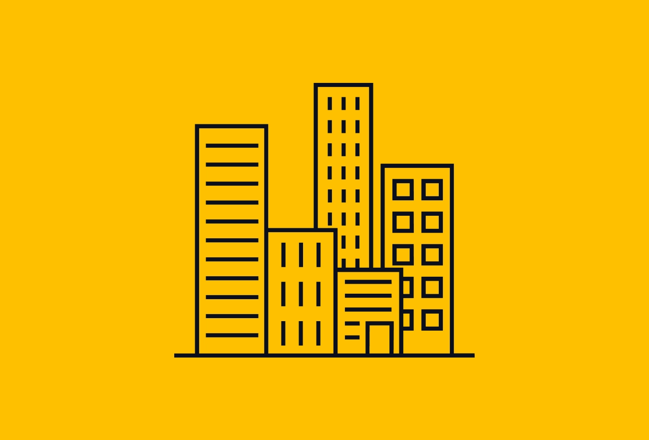 Black outlined buildings and skyscrapers forming city skyline on bright yellow background