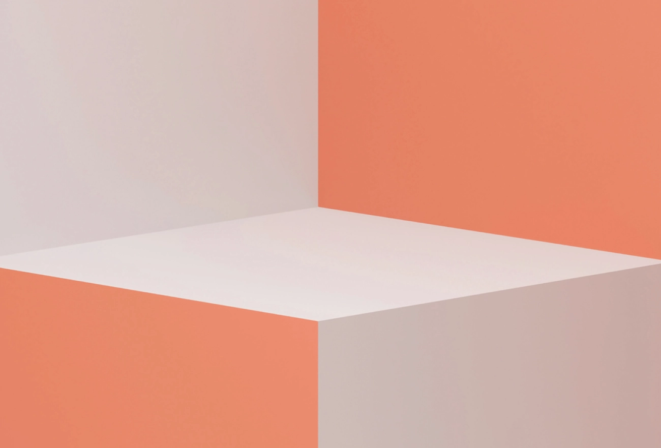 3D geometric room with coral and cream walls depicting minimalist interior space design