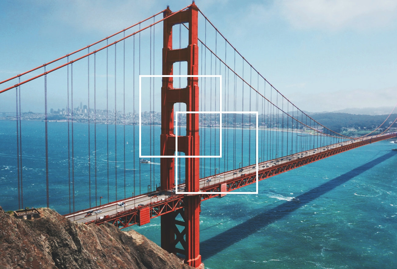 Golden Gate Bridge in San Francisco with white rectangular selection frames overlaid, showing the iconic red suspension bridge spanning blue water with city skyline in background