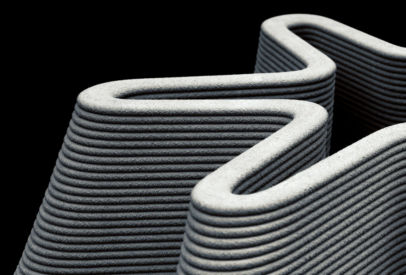 Textured gray fabric bowls with white handles stacked against dark background