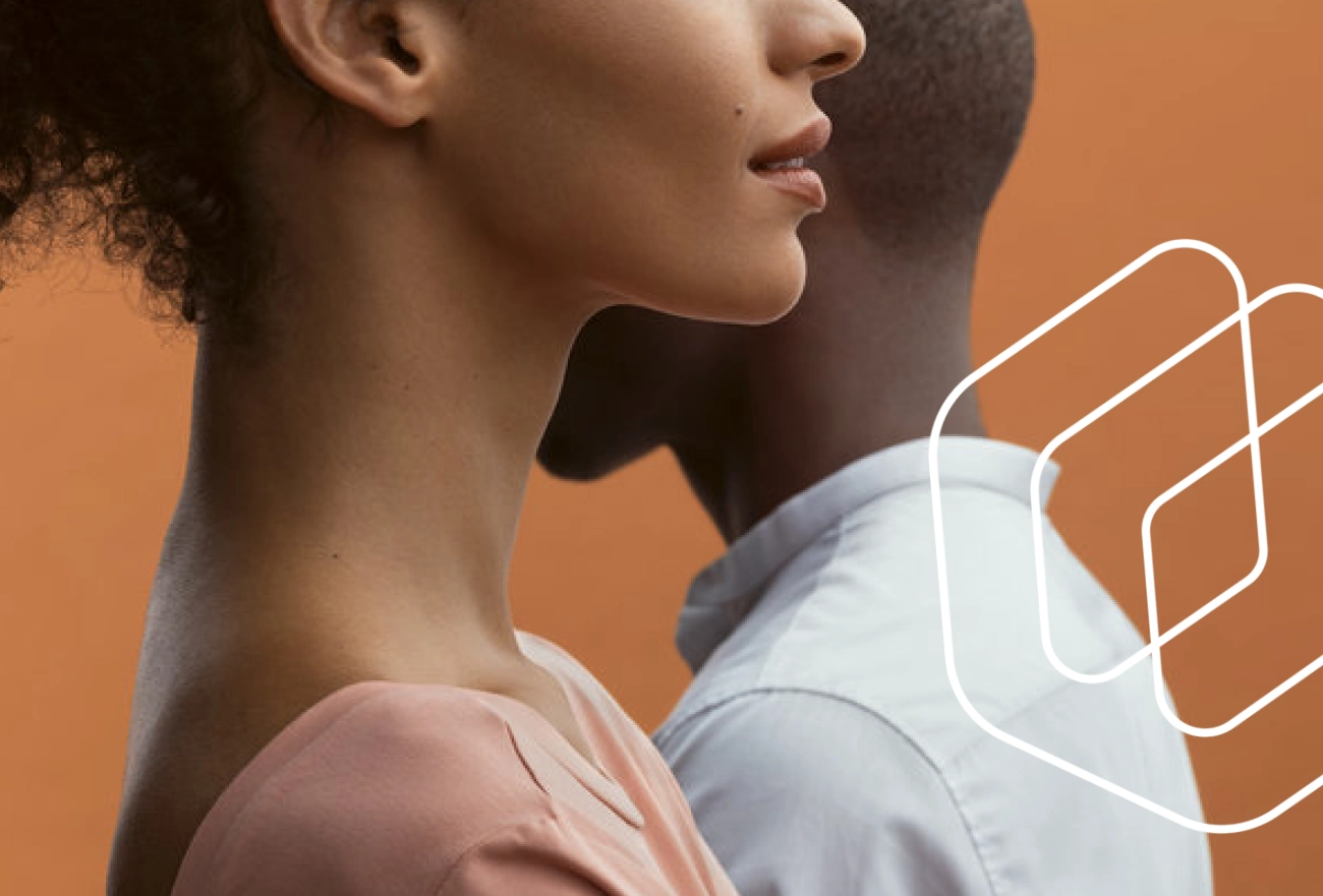 Woman's profile with white line illustration of digestive system anatomy overlay on orange background